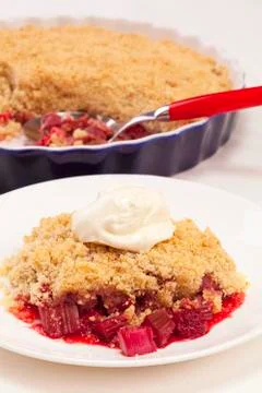 Rhubarb crumble with raspberry Stock Photos