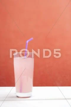 Rhubarb Juice With A Drinking Straw In A Glass