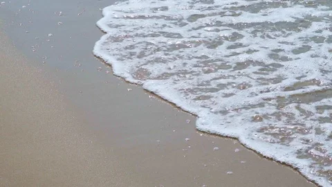 The rhythm of waves on the beautiful beach. Close up shot 4K Stock Footage 123399448