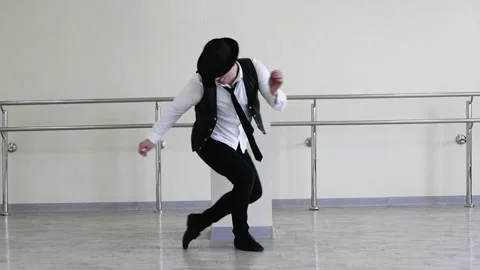 Rhythmic dance cha cha or bachata. Dancer in hat with tie and black vest  jazz Stock Footage 277849618