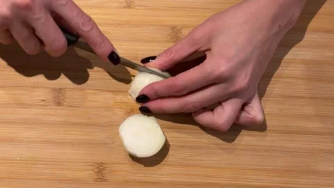 Rhythmic Dicing of a White Onion on a Wooden Board Stock Footage 328059957