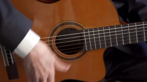 Rhythmic guitar playing using all strings Stock Footage 196155431