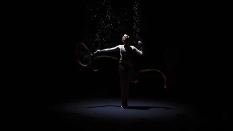 Rhythmic gymnast doing acrobatic moves with the ribbon. Computer graphics Stock-Footage 73588094