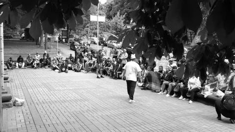 Rhythmic, loud beats, crashing helmets on the asphalt - at a sit-in miners. Stock Footage 134634044