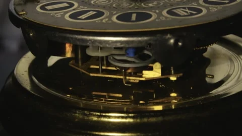 Rhythmic mechanical clock cog and gear movement CLOSE-UP Stock Footage 313738345