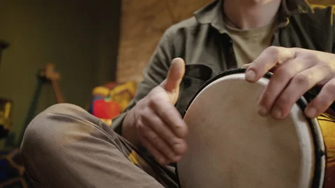 Rhythmic music. Close up of unrecognizable drummer hands beating music on drum Stock Footage 186991627