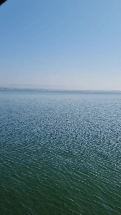 Rhythmic Serenity: Mesmerizing Boat Ride on a Tranquil Lake Stock Footage 304154456