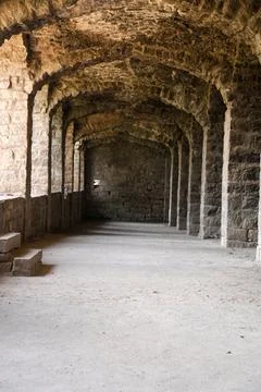 Rhythmic Stone Arcades Creating Historic Architectural Perspective Фото