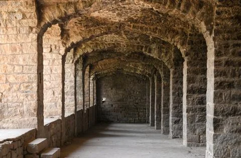 Rhythmic Stone Arcades Creating Historic Architectural Perspective Фото