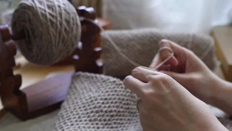 Rhythmically knitting a soft woolen garment by hand Video stock 315084816