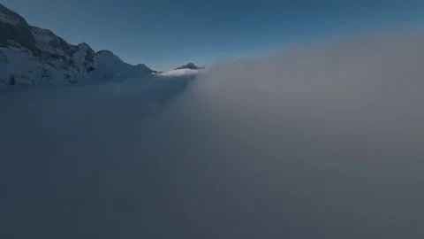 Rial FPV Cloud Surfing Winter Wonderland Majestic Scenery, 4K Stock Footage 323465645