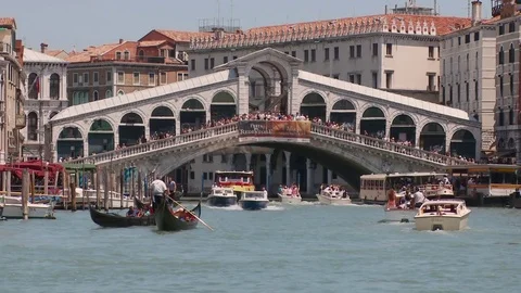 The Rialto Bridge and Gondolas from the middle of the Grand Canal, Venice Ita Stock Footage 83398665