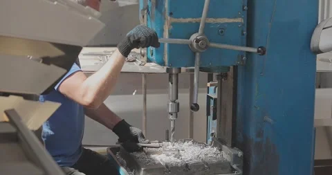 RIB boat manufacturing, worker makes a hole. Worker drills a hole in an aluminum Stock-Footage 336094871