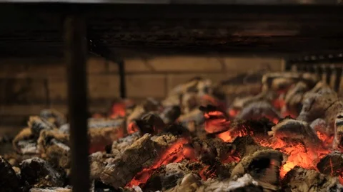 Rib-eye steak is cooked on coals on a lattice. the meat is fried over an open Stock Footage 106934990