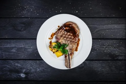 Rib-eye steak with corn. Stock Photos