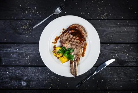 Rib-eye steak with corn. Stock Photos