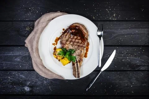 Rib-eye steak with corn. Stock Photos