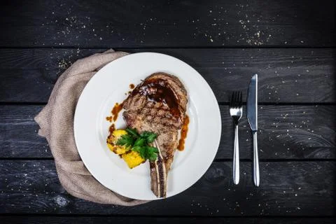 Rib-eye steak with corn. Stock Photos