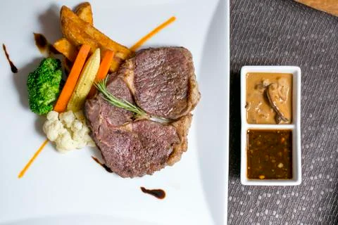 Rib-eye Steak on the table Stock Photos
