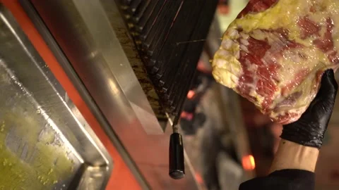 Rib meat is oiled and cooked on the grill 4K 100fps Vertical Stock Footage 181123713