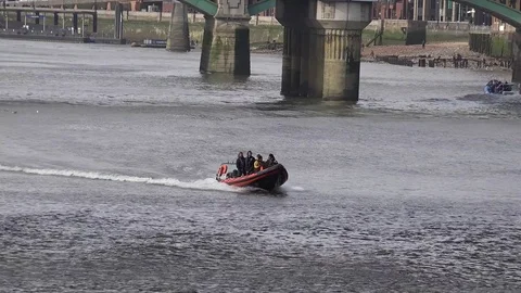 R.I.B passing under bridge on the Thames Stock Footage 72706427