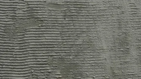 Ribbed concrete applied to the wall for better adhesion of the plaster Stock Footage 154975618