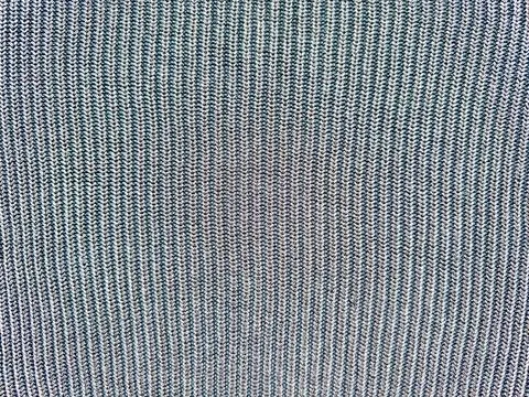 Ribbed knit fabric close up texture in blue gray tones displaying vertical pa Stock Photos