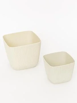 Ribbed plastic planter pot cream color pair Stock Photos