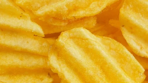 Ribbed potatoes snack chips close up Stock Footage 102185346
