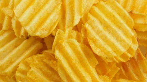 Ribbed potatoes snack chips close up Stock Footage 102185357