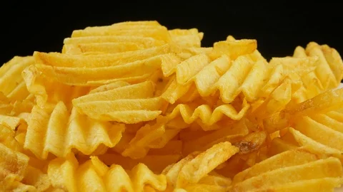 Ribbed potatoes snack chips close up Stock Footage 102185405