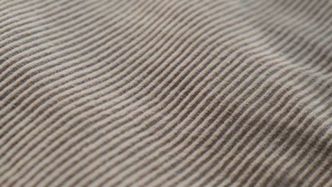 Ribbed texture of light beige corduroy fabric, close-up 库存影片 292925362