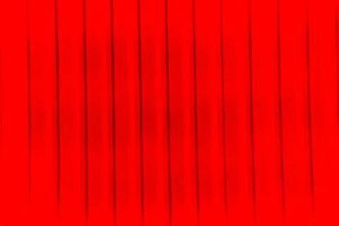 Ribbed wall of the shipping container. Red background with diagonal stripes.  Illustrazione stock