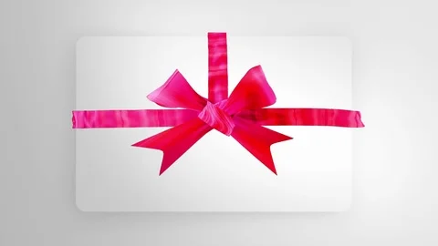 Ribbon Bows unpacking gift present top view on white background Stock Footage 83537889