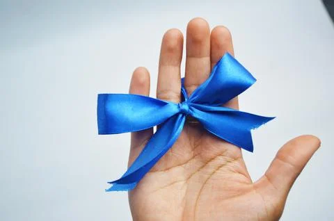 RIBBON IN HAND Stock Photos
