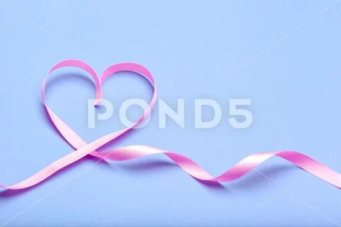 Photograph: Ribbon HIV, AIDS on blue background #103516882