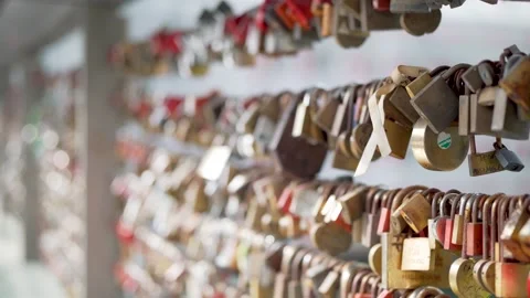 Ribbon on love locks on bridge with initials and names Stock Footage 280770800