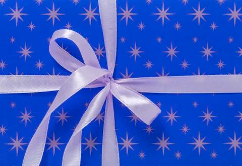 Ribbon on a red background. Stock Photos