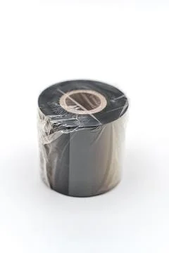 Ribbon roll for thermal printer on white background ready for use Stock Photos