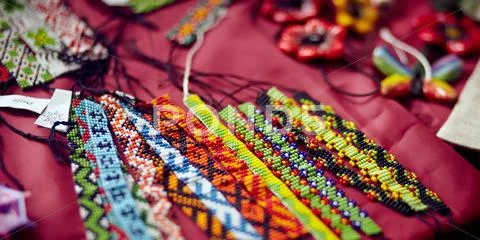 Ribbons embroidered by a bead. Stock Photos