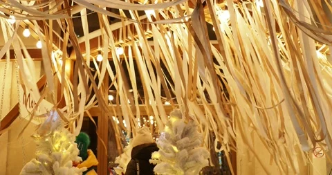 Ribbons of fabric move in the wind on the street illuminated by lights at Christ Video stock 228370153