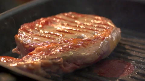Ribeye steak marbled beef smokes tasty slow motion Stock Footage 49830701