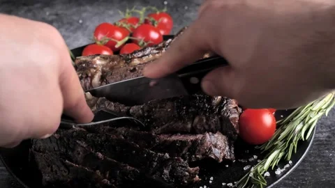 Ribeye Tomahawk Steak, Irish Beef, grilled ,cuts with a knife Stock Footage 194996911