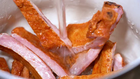 Ribs are cooked in a pan Stock Footage 249536035
