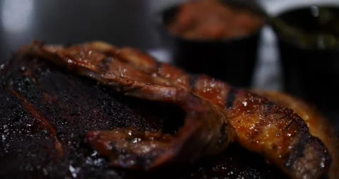 Ribs, brisket, pulled pork BBQ barbecued meat ready to eat smoked all day Video stock 151500975