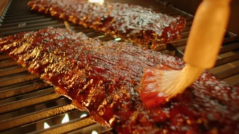 Ribs on Flaming Grill Basted GT0533 Stock Footage