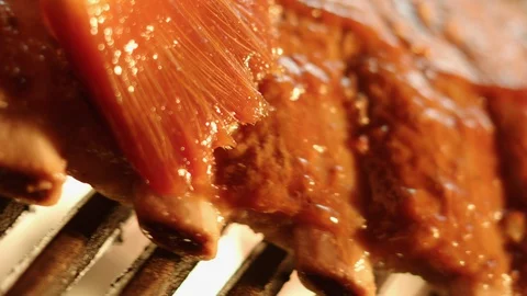 Ribs on Grill being brushed with Barbeque Sauce GT9031 Video stock 129639507