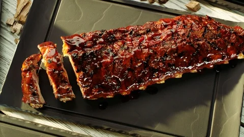 Ribs revealed by clouds of smokeCC Video stock 120882276