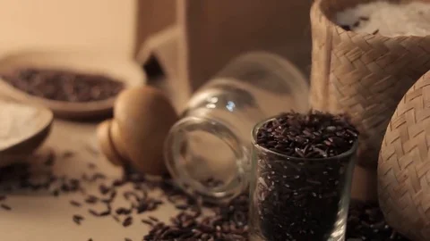 Rice and rice-berry uncooked brown rice in wooden spoon Stock Footage 69242587