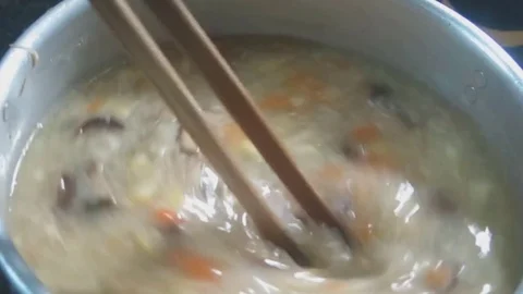 Rice and vegetable soup Stock Footage 70572250